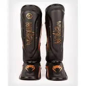 Venum Elite Evo scheenbeschermers zwart/brons