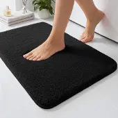 Unyqoos Zwarte absorberende badmat van microvezel met antislip en wasbaar ontwerp