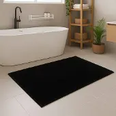 Unyqoos Zwarte wasbare badmat met antislip en zachte touch voor badkamer