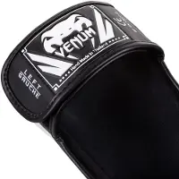 Venum Elite scheenbeschermer zwart/wit