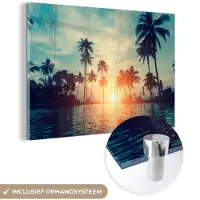 MuchoWow Glasschilderij - Foto op glas - Palmboom - Water - Zon - Acrylglas - 150x100 cm - Schilderij glas - Glasschilderij strand - Muurdecoratie glas - Glasschilderij natuur