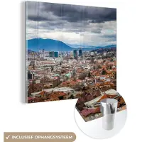 MuchoWow Glasschilderij 20x20 cm - Schilderij acrylglas - Wolkendek boven Sarajevo Bosnië en Herzegovina - Foto op glas - Schilderijen