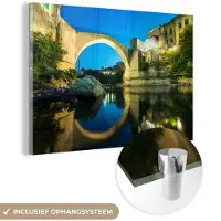 MuchoWow Glasschilderij 180x120 cm - Schilderij acrylglas - Schitterende lucht boven de Stari Most brug en mooie weerspiegeling in het water - Foto op glas - Schilderijen
