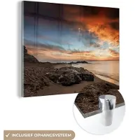 MuchoWow Glasschilderij 160x120 cm - Schilderij acrylglas - Strand - Stenen - Avond - Lucht - Natuur - Foto op glas - Schilderijen
