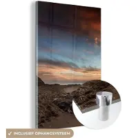 MuchoWow Glasschilderij 40x60 cm - Schilderij acrylglas - Strand - Stenen - Avond - Lucht - Natuur - Foto op glas - Schilderijen