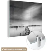 MuchoWow Glasschilderij - Pier - Water - Zwart - Wit - Schilderij glas - Muurdecoratie - 20x20 cm - Foto op glas - Glazen plaat