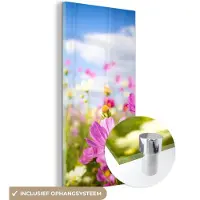 MuchoWow Glasschilderij 20x40 cm - Schilderij acrylglas - Bloemen - Wei - Paars - Gras - Wit - Wolken - Blauw - Foto op glas - Muurdecoratie woonkamer - Wanddecoratie slaapkamer - Schilderijen