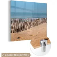 MuchoWow Glasschilderij 50x50 cm - Schilderij acrylglas - Strand - Zee - Palen - Foto op glas - Muurdecoratie woonkamer - Wanddecoratie slaapkamer - Schilderijen