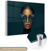 MuchoWow Glasschilderij 90x60 cm - Schilderij acrylglas - Vrouw - Vlinder - Bril - Blauw - Modern - Portret - Foto op glas - Muurdecoratie woonkamer - Wanddecoratie slaapkamer - Schilderijen