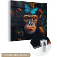 MuchoWow Glasschilderij 50x50 cm - Schilderij acrylglas - Chimpansee - Aap - Natuur - Blauwe vlinder - Foto op glas - Muurdecoratie woonkamer - Wanddecoratie slaapkamer - Schilderijen