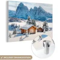 MuchoWow Glasschilderij 180x120 cm - Schilderij acrylglas - Winter - Huisje - Bergen - Uitzicht - Sneeuw - Foto op glas - Muurdecoratie woonkamer - Wanddecoratie slaapkamer - Schilderijen