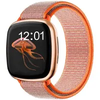 Strap-it nylon smartwatch bandje geschikt voor Fitbit Sense / Versa 3 (oranje) – ademend, lichtgewicht en verstelbaar – vervangende polsband voor Fitbit smartwatch