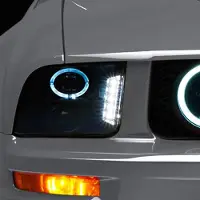 Raxiom 05-09 Ford Mustang w/ Halogen LED Halo Prjctr Headlights-Blk Hsng(Smoked Lens Exclude GT500)