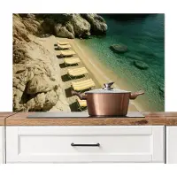 KitchenYeah Spatscherm keuken 100x65 cm - Kookplaat achterwand Strandbedden - Zee - Stenen - Baai - Muurbeschermer - Spatwand fornuis - Hoogwaardig aluminium