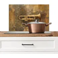 KitchenYeah Spatscherm keuken 70x50 cm - Kookplaat achterwand Trompet - Geel - Muzikaal - Muurbeschermer - Spatwand fornuis - Hoogwaardig aluminium