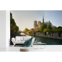 MuchoWow Behang - Fotobehang De Notre-Dame in Parijs met een zonsondergang - Breedte 390 cm x hoogte 260 cm