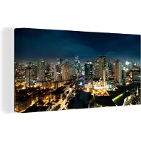 MuchoWow Canvas schilderij 160x80 cm - Wanddecoratie Nachtfoto van Manila - Muurdecoratie woonkamer - Slaapkamer decoratie - Kamer accessoires - Schilderijen