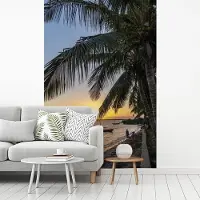 MuchoWow Behang - Fotobehang Zonsondergang boven de vissershaven in Mozambique - Breedte 175 cm x hoogte 260 cm