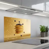 KitchenYeah Spatscherm 70x50 cm - Zelfklevende achterwand Pannenkoeken - Eten - Honing - Geel - Keuken muurbeschermer - Spatwand fornuis