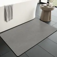 Unyqoos Grijze antislip badmat 43x70 cm voor badkamer en douche, sneldrogend