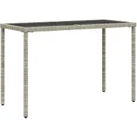 vidaXL Tuintafel met glazen blad 115x54x74 cm poly rattan lichtgrijs