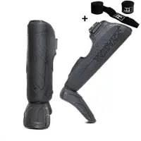 Joya ESSENTIAL Scheenbeschermers – Maat L – Zwart/Zwart – Kickboksen/Muay Thai/MMA – Ergonomische pasvorm, schokabsorberende padding – Inclusief Bandage