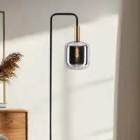LumenXL Staande vloerlamp Piedi in zwart met smoke glas en goud