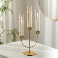 Unyqoos Driearmige gouden kandelaar met glazen cilinders voor sfeervolle decoratie