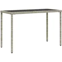 vidaXL Tuintafel met glazen blad 115x54x74 cm poly rattan lichtgrijs