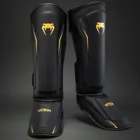 Venum G-Core Scheenbeschermers – Zwart/Goud voor Kickboksen & Muay Thai - XL